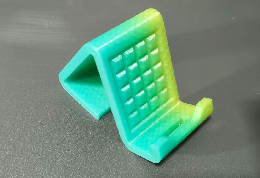 Zaļi dzeltens telefona statīvs